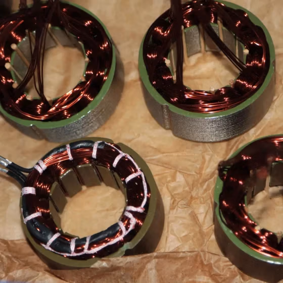 Arc-shaped stator insulation cover for motor stator winding protection and compact motor design