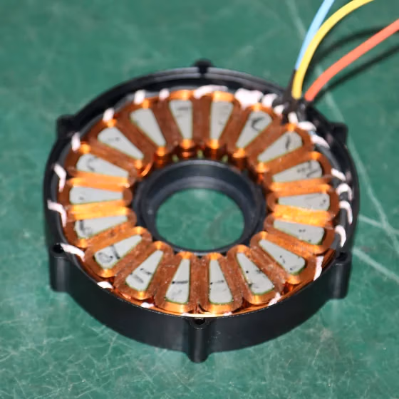 High-efficiency axial flux hub motor with laminated stator core and multi-pole rotor design